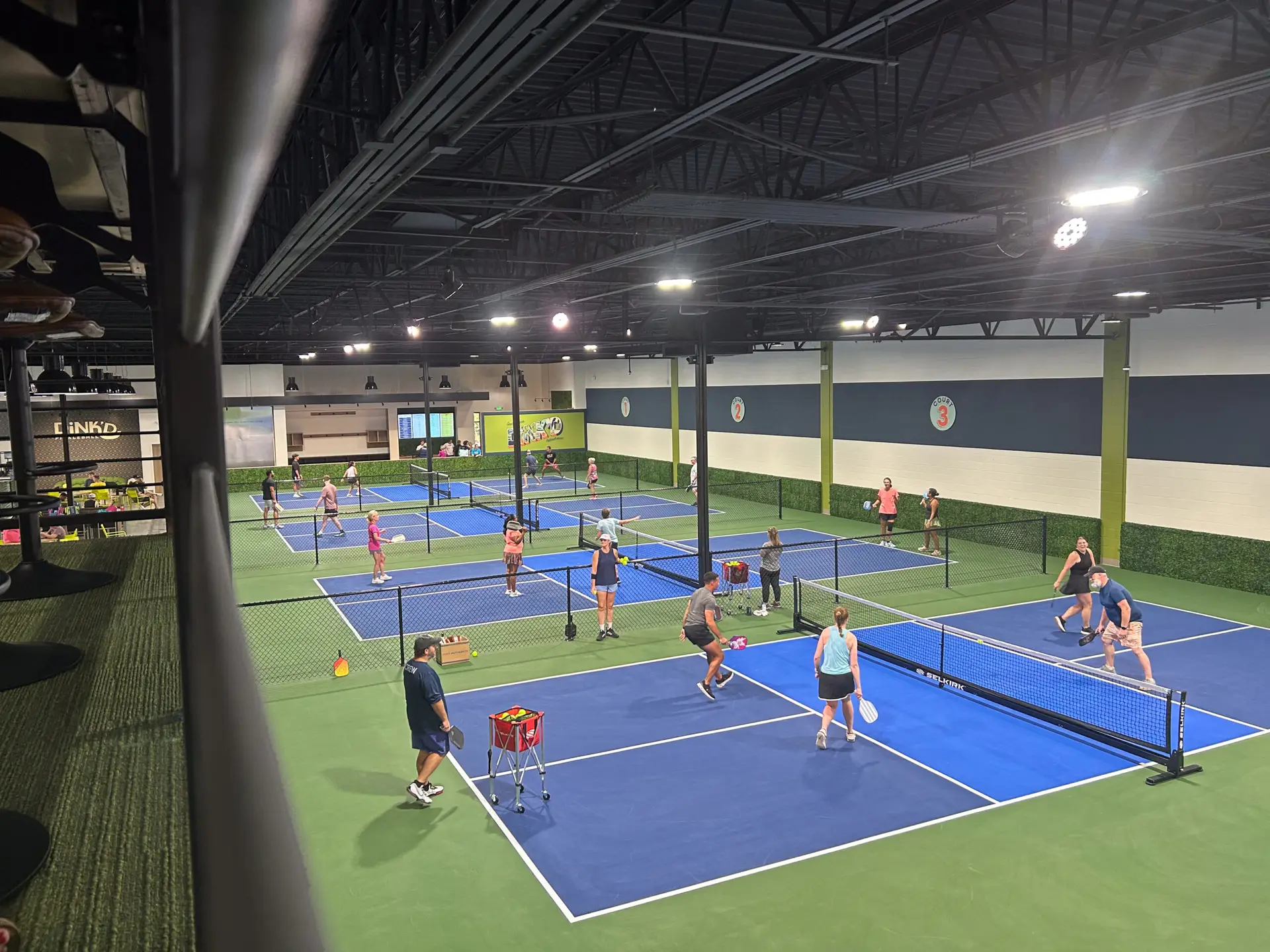 Players on the indoor pickleball courts
